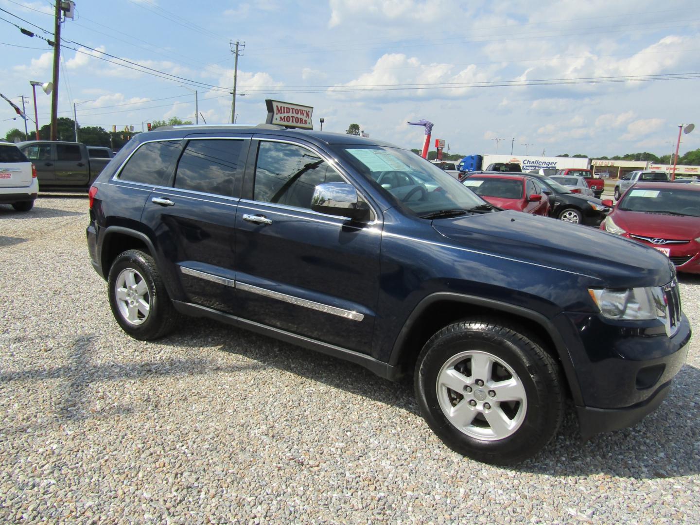 2013 Blue /Tan Jeep Grand Cherokee Laredo 2WD (1C4RJEAG1DC) with an 3.6L V6 DOHC 24V engine, Automatic transmission, located at 15016 S Hwy 231, Midland City, AL, 36350, (334) 983-3001, 31.306210, -85.495277 - Photo#0
